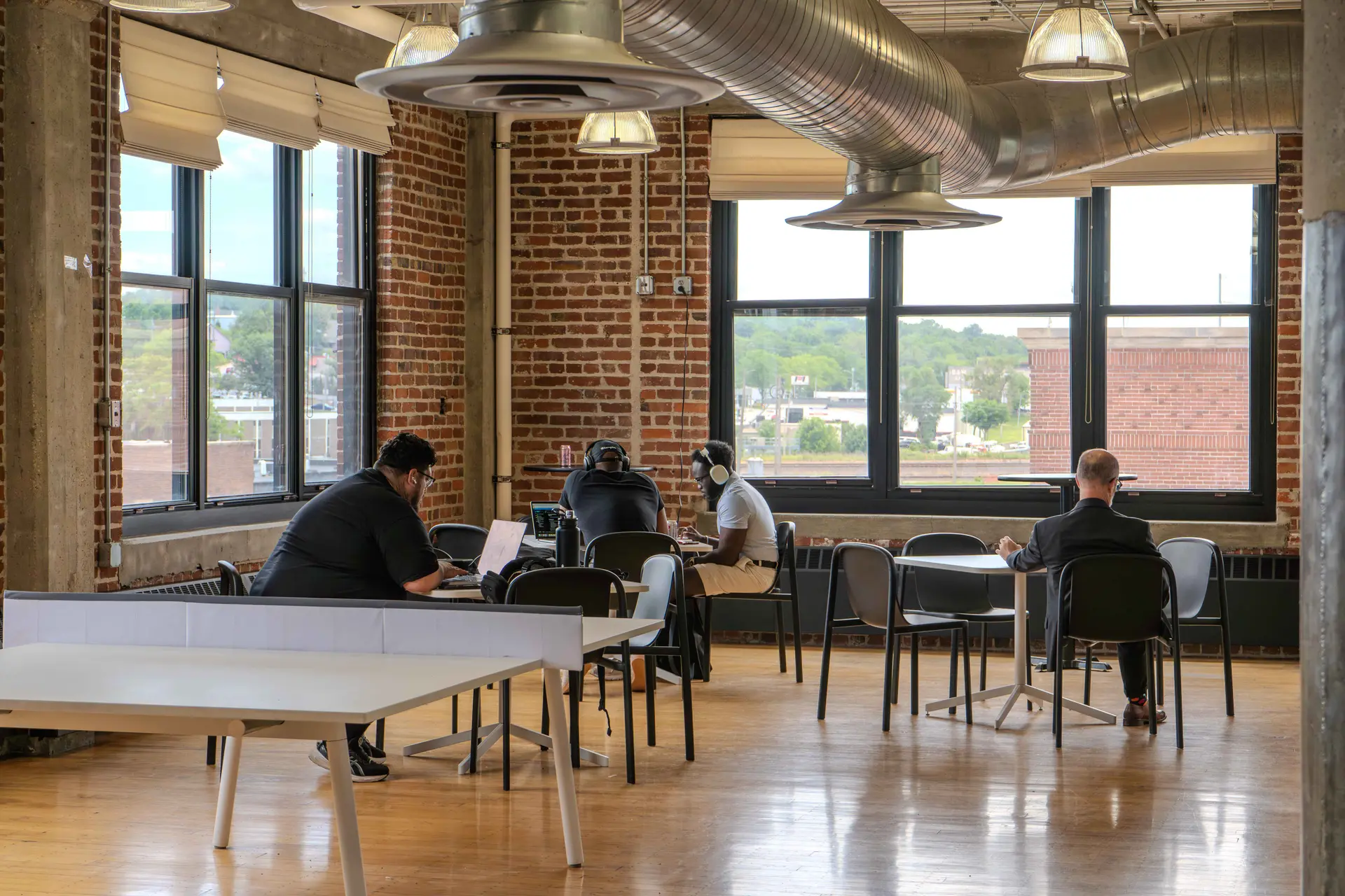 Members working on the coworking floor at Elevator Omaha