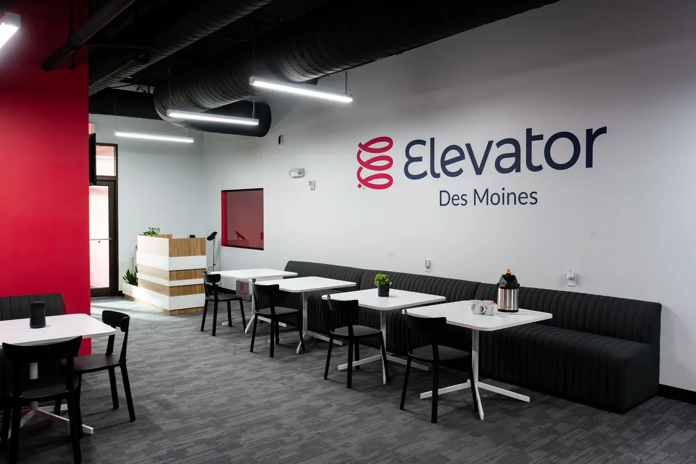 The café seating and front desk at Elevator Des Moines