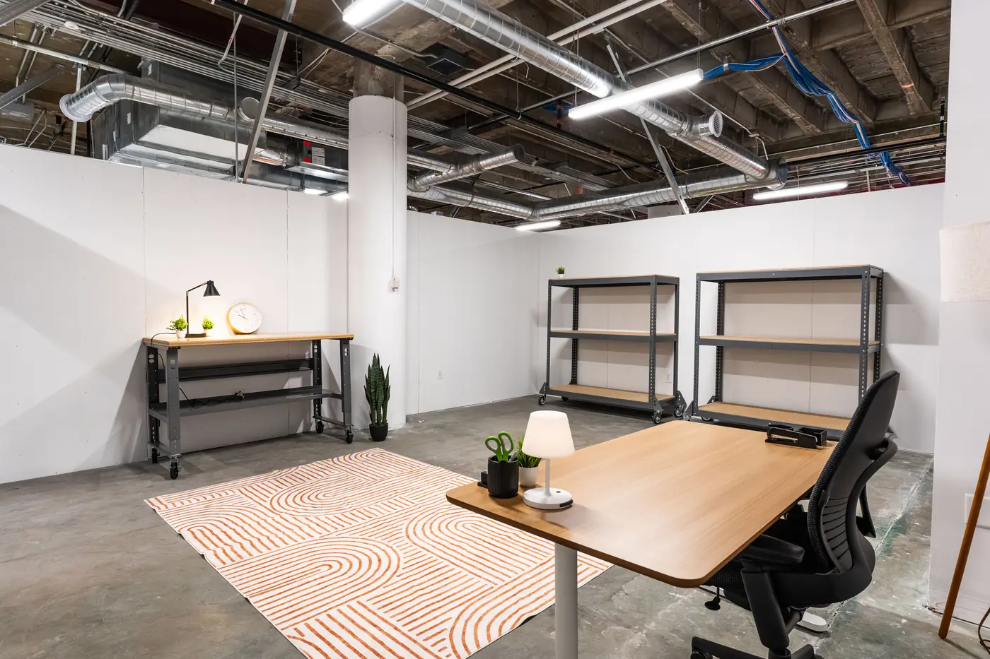 A warehouse unit set up as a workspace at Elevator Des Moines