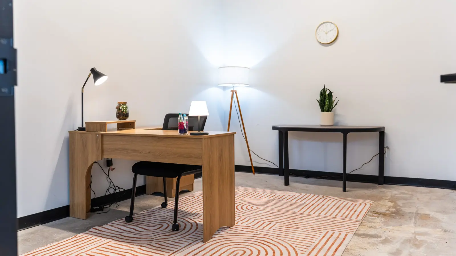Private office with desk and lamp at Elevator North Kansas City