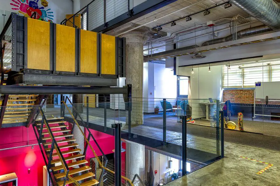 Mezzanine and stairs over the open workspace floor at Elevator Omaha
