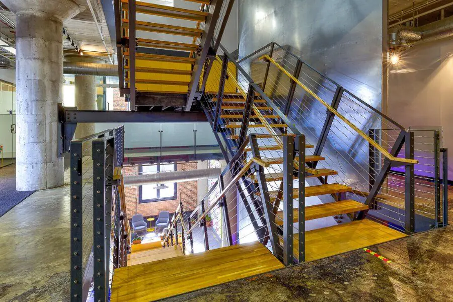 Steel staircase connecting floors at Elevator Omaha