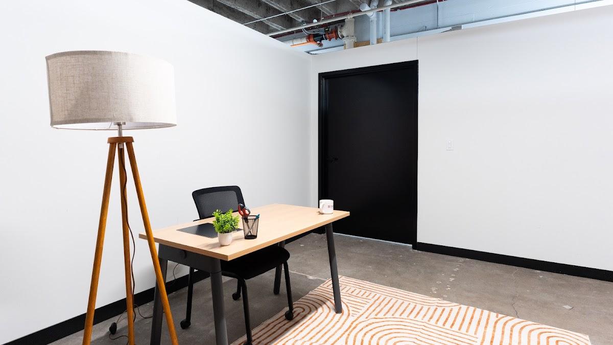 A staged private office at Elevator Lincoln