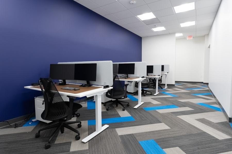 Dedicated desks with monitors at Elevator St. Louis