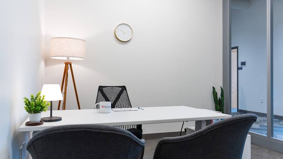 Staged office with lamp and chairs, St. Louis
