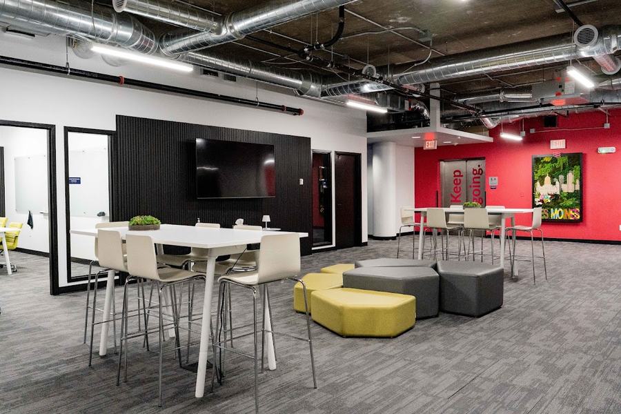 High-top tables and lounge seating on the coworking floor at Elevator Des Moines
